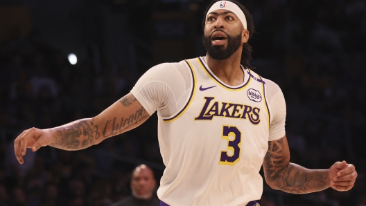 Los Angeles Lakers forward/center Anthony Davis reacts after he missed an opportunity to score during the first half of an NBA basketball game against the Trail Blazers, Sunday, Dec. 8, 2024, in Los Angeles. (AP Photo/Etienne Laurent)