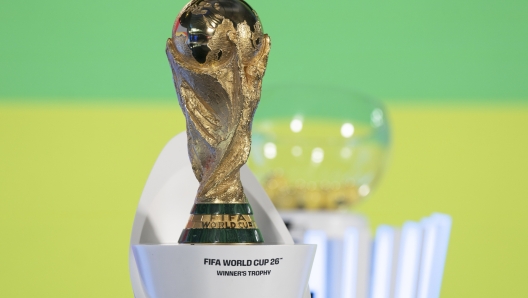 The World Cup trophy is seen before the UEFA Preliminary Draw for the 2026 FIFA World Cup at FIFA headquarters in Zurich, Switzerland, Friday, December 13, 2024. (Til Buergy/Keystone via AP)