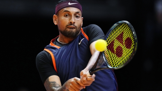 FILE - Nick Kyrgios of Eagles returns the ball to Grigor Dimitrov of Falcons during a match of Day 3 of the World Tennis League at Coca-Cola Arena in Dubai, United Arab Emirates, on Dec. 21, 2022.  (AP Photo/Kamran Jebreili, File)