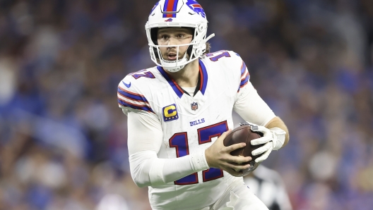 Buffalo Bills quarterback Josh Allen (17) runs against the Detroit Lions during the second half of an NFL football game, Sunday, Dec. 15, 2024, in Detroit. (AP Photo/Rey Del Rio)