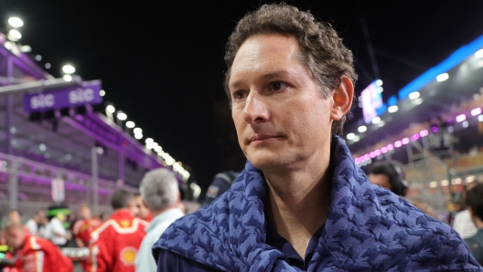 Ferrari's Chairman and CEO John Elkann walks next to the Ferrari cars ahead of the Saudi Arabian Formula One Grand Prix at the Jeddah Corniche Circuit in Jeddah on March 9, 2024. (Photo by Giuseppe CACACE / AFP)