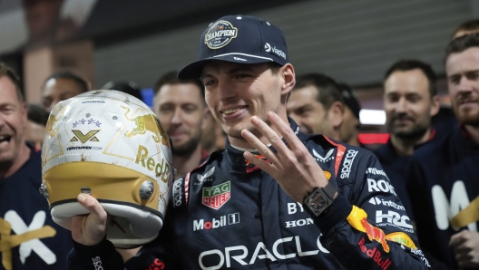 Red Bull driver Max Verstappen, of the Netherlands, celebrates winning the Formula 1 championship after the F1 Las Vegas Grand Prix auto race, Sunday, Nov. 24, 2024, in Las Vegas. (AP Photo/Matt York)