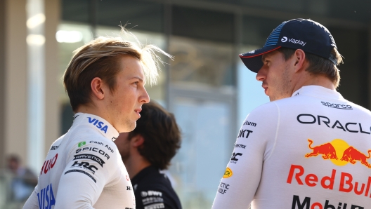 ABU DHABI, UNITED ARAB EMIRATES - DECEMBER 08: Liam Lawson of New Zealand and Visa Cash App RB talks to Max Verstappen of the Netherlands and Oracle Red Bull Racing prior to the F1 Grand Prix of Abu Dhabi at Yas Marina Circuit on December 08, 2024 in Abu Dhabi, United Arab Emirates. (Photo by Mark Thompson/Getty Images)