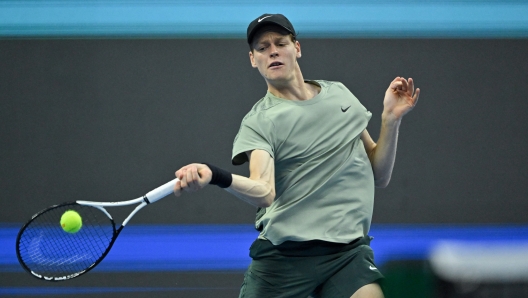 Italys Jannik Sinner hits a return against Chiles Nicolas Jarry during their mens singles match at the China Open tournament in Beijing on September 26, 2024. (Photo by ADEK BERRY / AFP)