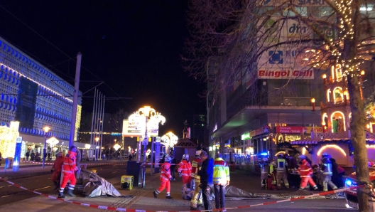 Police and rescue personnel cordon off the area next to a Christmas market, where a car crashed into a crowd killing and injuring people, according to media, on December 12, 2024 in Magdeburg. (Photo by Doerthe HEIN / DPA / AFP) / Germany OUT