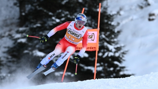 Switzerland's Marco Odermatt competes in the Men's Downhill race as part of the FIS Alpine ski World Cup 2024-2025, in Val Gardena on December 21, 2024. (Photo by Marco BERTORELLO / AFP)