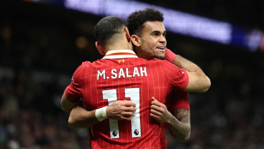 LONDON, ENGLAND - DECEMBER 22: Luis Diaz of Liverpool celebrates scoring his team's sixth goal with teammate Mohamed Salah during the Premier League match between Tottenham Hotspur FC and Liverpool FC at Tottenham Hotspur Stadium on December 22, 2024 in London, England. (Photo by Alex Pantling/Getty Images)