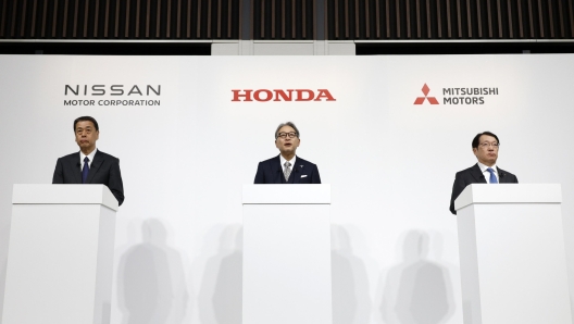 epaselect epa11790643 (L-R) Nissan Motor Co. President and CEO Makoto Uchida, Honda Motor Co. President Toshihiro Mibe, and Mitsubishi Motors Corp. President and CEO Takao Kato speak during a joint press conference in Tokyo, Japan, 23 December 2024. Nissan, Honda, and Mitsubishi Motors have signed a memorandum of understanding (MOU) to explore Mitsubishi Motorsâ?? potential participation and synergy-sharing in the business integration outlined in a previous MOU between Nissan and Honda.  EPA/FRANCK ROBICHON