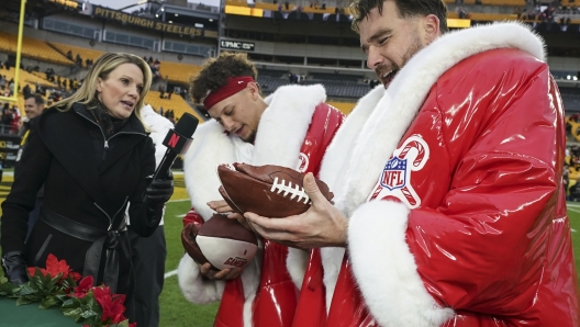 Kansas City Chiefs quarterback Patrick Mahomes and Travis Kelce speak after an NFL football game against the Pittsburgh Steelers, Wednesday, Dec. 25, 2024, in Pittsburgh. (AP Photo/Matt Freed)