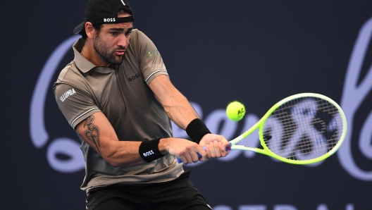 epa11798512 Matteo Berrettini of Italy in action against Jordan Thompson of Australia during their Brisbane International tennis tournament first round match at Queensland Tennis Centre in Brisbane, Australia, 30 December 2024.  EPA/JONO SEARLE AUSTRALIA AND NEW ZEALAND OUT