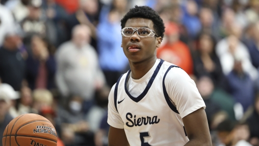 FILE - Sierra Canyon's Bryce James #5 warms up against Christopher Columbus at halftime during a high school basketball game at the Hoophall Classic, on January 16, 2023, in Springfield, MA. (AP Photo/Gregory Payan, File)