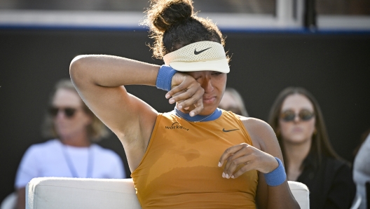 Naomi Osaka of Japan is emotional after forfeiting her match against Clara Tauson of Denmark in the finals singles match of the ASB Classic tennis tournament at Manuka Doctor Arena in Auckland, New Zealand, Sunday, Jan. 5, 2025. (Alan Lee/Photosport via AP)