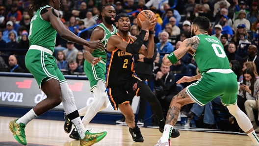 OKLAHOMA CITY, OKLAHOMA - JANUARY 5: Shai Gilgeous-Alexander #2 of the Oklahoma City Thunder handles the ball during the first half against the Boston Celtics at Paycom Center on January 5, 2025 in Oklahoma City, Oklahoma. NOTE TO USER: User expressly acknowledges and agrees that, by downloading and or using this photograph, User is consenting to the terms and conditions of the Getty Images License Agreement.   Joshua Gateley/Getty Images/AFP (Photo by Joshua Gateley / GETTY IMAGES NORTH AMERICA / Getty Images via AFP)