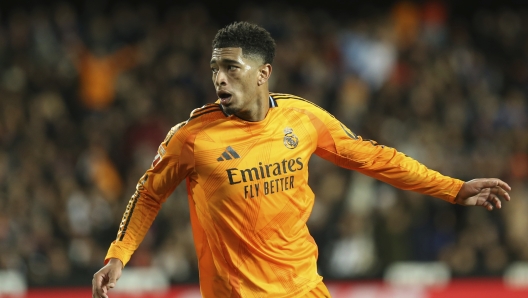 Real Madrid's Jude Bellingham celebrates after scoring his side's 2nd goal against Valencia during a Spanish La Liga soccer match at Mestalla stadium in Valencia, Spain, Friday, Jan. 3, 2025. (AP Photo/Alberto Saiz)