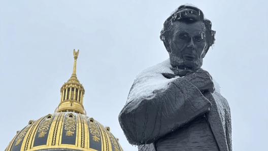 A statue of former U.S. President Abraham Lincoln is shown covered in snow and ice outside the West Virginia State Capitol in Charleston, W. Va. on Monday, Jan. 6, 2024. (AP Photo/Leah Willingham)