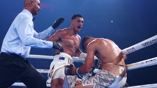 GOLD COAST, AUSTRALIA - JANUARY 08: Jai Opetaia knocks down David Nyika during the IBF And Ring Magazine Cruiserweight World Title Fight between Jai Opetaia and David Nyika at the Gold Coast Convention Centre on January 08, 2025 in Gold Coast, Australia. (Photo by Chris Hyde/Getty Images)