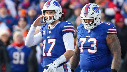 ORCHARD PARK, NEW YORK - JANUARY 12: Josh Allen #17 of the Buffalo Bills walks off the field during the first quarter against the Denver Broncos during the AFC Wild Card Playoffs at Highmark Stadium on January 12, 2025 in Orchard Park, New York.   Elsa/Getty Images/AFP (Photo by ELSA / GETTY IMAGES NORTH AMERICA / Getty Images via AFP)