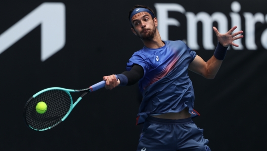 MELBOURNE, AUSTRALIA - JANUARY 16: Lorenzo Musetti of Italy plays a forehand against Denis Shapovalov of Canada in the Men's Singles Second Round match during day five of the 2025 Australian Open at Melbourne Park on January 16, 2025 in Melbourne, Australia. (Photo by Kelly Defina/Getty Images)