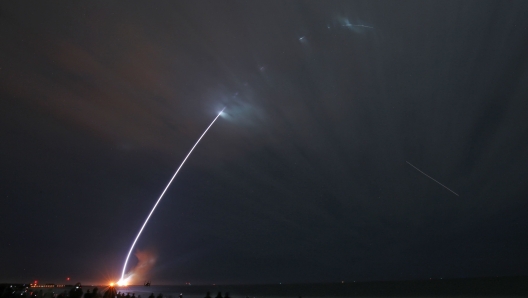 A Blue Origin New Glenn rocket streaks into orbit after launching from the Kennedy Space Center on its maiden flight, at Cape Canaveral, Florida on January 16, 2025. Blue Origin, the space company founded by billionaire Jeff Bezos, launched its massive New Glenn rocket for the first time early Thursday January 16, a livestream of the blastoff showed. The rocket, whose inaugural mission had been delayed by several years, and which is seen as critical to Blue Origin's efforts to compete with Elon Musk's SpaceX, blasted of at 2:03 am (0703 GMT) from the Cape Canaveral Space Force Base in the US state of Florida, a webcast showed. (Photo by Gregg Newton / AFP)