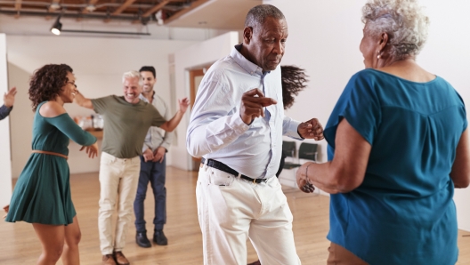 People Attending Dance Class In Community Center