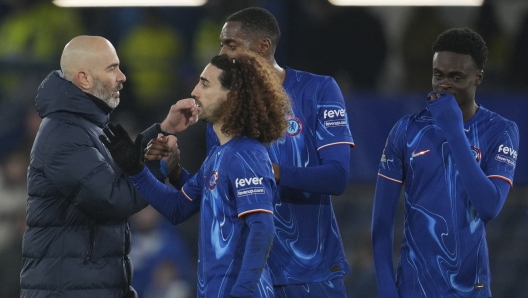 Chelsea's head coach Enzo Maresca, left, celebrates with his players at the end of the English Premier League soccer match between Chelsea and?Wolverhampton at Stamford Bridge stadium in London, Monday, Jan. 20, 2025. (AP Photo/Kin Cheung)