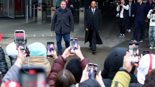 FIORANO MODENESE, ITALY - JANUARY 20: Sir Lewis Hamilton greets fans during his first official days as a Scuderia Ferrari F1 driver at Fiorano Circuit on January 20, 2025 in Fiorano Modenese, Italy. (Photo by Clive Rose/Getty Images)