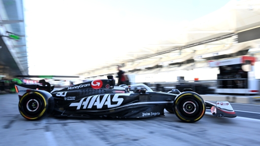 ABU DHABI, UNITED ARAB EMIRATES - DECEMBER 10: Oliver Bearman of Great Britain driving the (50) Haas F1 VF-24 Ferrari leaves the garage during Formula 1 testing at Yas Marina Circuit on December 10, 2024 in Abu Dhabi, United Arab Emirates. (Photo by Mark Sutton/Getty Images)