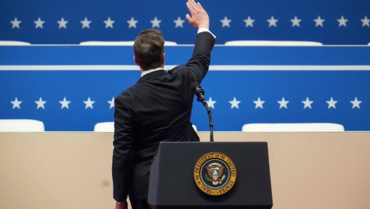 WASHINGTON, DC - JANUARY 20: Tesla, SpaceX and X CEO Elon Musk gestures while speaking during an inauguration event at Capital One Arena on January 20, 2025 in Washington, DC. Donald Trump takes office for his second term as the 47th president of the United States.   Christopher Furlong/Getty Images/AFP (Photo by Christopher Furlong / GETTY IMAGES NORTH AMERICA / Getty Images via AFP)