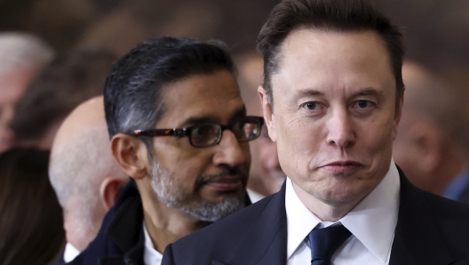 Elon Musk, right, and Google CEO Sundar Pichai arrive before the 60th Presidential Inauguration in the Rotunda of the U.S. Capitol in Washington, Monday, Jan. 20, 2025. (Kevin Lamarque/Pool Photo via AP)