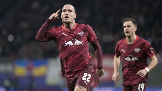 Leipzig's David Raum celebrates a goal that was later disallowed by VAR decision during the Champions League soccer match between RB Leipzig and Sporting CP at the RB Arena in Leipzig, Germany, Wednesday, Jan. 22, 2025. (AP Photo/Matthias Schrader)