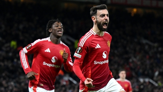 MANCHESTER, ENGLAND - JANUARY 23: Bruno Fernandes of Manchester United celebrates scoring his team's second goal during the UEFA Europa League 2024/25 League Phase MD7 match between Manchester United and Rangers FC at Old Trafford on January 23, 2025 in Manchester, England. (Photo by Shaun Botterill/Getty Images)