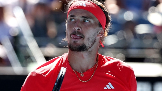 Germany's Alexander Zverev reacts to a point against Serbia's Novak Djokovic during their men's singles semi-final match on day thirteen of the Australian Open tennis tournament in Melbourne on January 24, 2025. (Photo by Martin KEEP / AFP) / -- IMAGE RESTRICTED TO EDITORIAL USE - STRICTLY NO COMMERCIAL USE --