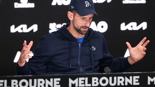 Serbia's Novak Djokovic speaks during a press conference after retiring from his men's singles semi-final match against Germany's Alexander Zverev on day thirteen of the Australian Open tennis tournament in Melbourne on January 24, 2025. (Photo by DAVID GRAY / AFP) / -- IMAGE RESTRICTED TO EDITORIAL USE - STRICTLY NO COMMERCIAL USE --