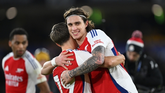  Riccardo Calafiori of Arsenal celebrates victory with teammate Leandro Trossard following the Premier League match between Wolverhampton Wanderers FC and Arsenal FC at Molineux on January 25, 2025 in Wolverhampton, England. (Photo by Shaun Botterill/Getty Images)