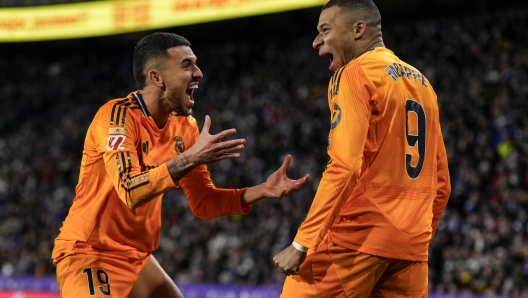 Real Madrid's Kylian Mbappe celebrates after scoring his side's second goal during the Spanish La Liga soccer match between Valladolid and Real Madrid at the Jose Zorrilla stadium in Valladolid, Spain, Saturday, Jan. 25, 2025. (AP Photo/Manu Fernandez)