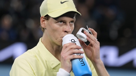 Jannik Sinner of Italy takes a drink during the men's singles final against Alexander Zverev of Germany at the Australian Open tennis championship in Melbourne, Australia, Sunday, Jan. 26, 2025. (AP Photo/Ng Han Guan)