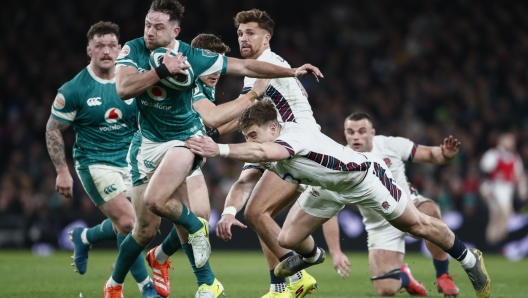 Ireland's Hugo Keenan is tackled by England's Tommy Freeman during the Six Nations rugby union match between Ireland and England at the Aviva Stadium in Dublin, Saturday, Feb. 1, 2025. (AP Photo/Peter Morrison)