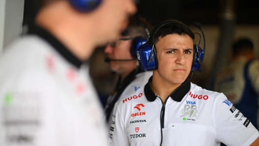 (FILES) Isack Hadjar of France and reserve driver for RB looks on in the garage during practice ahead of the F1 Grand Prix of United States at Circuit of The Americas on October 18, 2024 in Austin, Texas. Twenty years old Hadjar will discover Formula 1 next season after signing with the Racing Bulls team, little sister of Red Bull, his new Italian team announced on December 20, 2024 in a press release. (Photo by Rudy CAREZZEVOLI / GETTY IMAGES NORTH AMERICA / AFP)