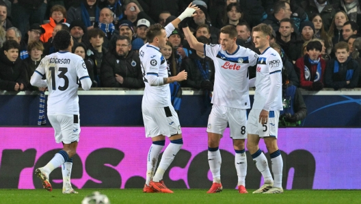 Atalanta's Croatian midfielder #08 Mario Pasalic celebrates scoring his team's first goal during the UEFA Champions League knockout phase play-off 1st leg football match between Club Brugge KV and Atalanta at the Jan-Breydel stadium in Sint-Andries, Bruges, on February 12, 2025. (Photo by NICOLAS TUCAT / AFP)