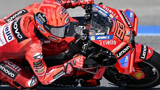 TOPSHOT - Ducati Lenovo Team's Spanish rider Marc Marquez powers his bike during the second day of the 2025 Thailand MotoGP pre-season test at the Buriram International Circuit in Buriram on February 13, 2025. (Photo by MANAN VATSYAYANA / AFP)