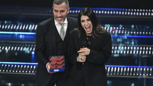 Italian singer Giorgia receives the TIM award from the CEO of TIM, Pietro Labriola on stage at the Ariston theatre during the 75th edition of the Sanremo Italian Song Festival, in Sanremo, Italy, 15 February 2025. The music festival will run from 11 to 15 February 2025.  ANSA/ETTORE FERRARI