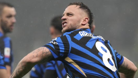 Inter Milan's Marko Arnautovic celebrates after scoring his side's opening goal during an Italian Cup quarter final soccer match between Inter Milan and Lazio, at the San Siro stadium in Milan, Italy, Tuesday, Feb. 25, 2025. (AP Photo/Luca Bruno)