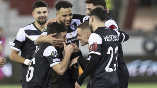 Lugano's Mattia Bottani, center right, celebrates scoring with teammates Mattia Zanotti, left, and Milton Valenzuela, right, during the Conference League opening phase soccer match between FC Lugano and Pafos FC at the Stockhorn Arena, in Thun, Switzerland, Thursday, Dec. 19, 2024. (Anthony Anex/Keystone via AP)