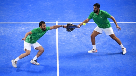 RIYADH, SAUDI ARABIA - OCTOBER 10: Mohammed Hadi and Hani Alhalwani of Team Saudi Olympic and Paralympic Committee compete against Hussam Alamoudi and Bader Ahmed of Team Saudi Olympic and Paralympic Committee during the Padel Rush Men's Doubles Group C Match 6 on day eight of the Saudi Games 2024 on October 10, 2024 in Riyadh, Saudi Arabia. The Saudi Games is a multi-game combined sports tournament and the largest national sporting event held annually in the Kingdom. (Photo by Stuart Franklin/Getty Images for Saudi Games)