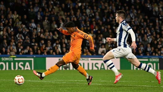 Real Madrid's Brazilian forward #16 Endrick (L) scores the opening goal during the Spanish Copa del Rey (King's Cup) semi-final first leg football match between Real Sociedad and Real Madrid CF at the Anoeta stadium in San Sebastian, on February 26, 2025. (Photo by ANDER GILLENEA / AFP)