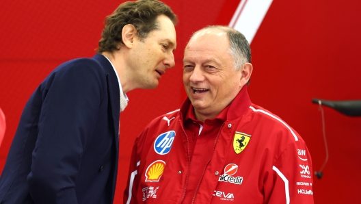 BAHRAIN, BAHRAIN - FEBRUARY 27: John Elkann, Chairman and CEO of Ferrari and Frederic Vasseur, Team Principal of Scuderia Ferrari talk in the garage during day two of F1 Testing at Bahrain International Circuit on February 27, 2025 in Bahrain, Bahrain. (Photo by Clive Rose/Getty Images)