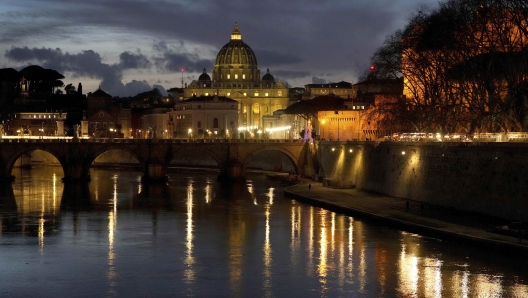 St Peter's Basilica at The Vatican is seen at dusk across the river Tiber in Rome, Italy Friday, Feb. 28, 2025. (AP Photo/Kirsty Wigglesworth)