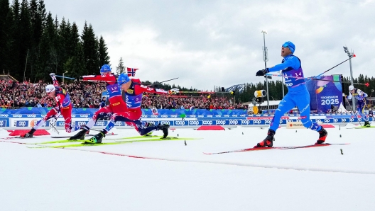 (LtoR) Norway's Harald Oestberg Amundsen, Norway's Jan Thomas Jenssen, Norway's Martin Loewstroem Nyenget and Italy's Federico Pellegrino compete to cross the finish line of the men's 20km skiathlon classic free event of the FIS Nordic Ski World Championships in Trondheim, Norway on March 1, 2025. (Photo by Lise ?serud / AFP)