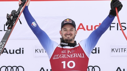 The winner Italy's Dominik Paris celebrates after an alpine ski, men's World Cup downhill, in Kvitfjell, Norway, Saturday, March 8, 2025. (AP Photo/Marco Trovati)