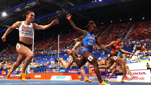 APELDOORN, NETHERLANDS - MARCH 09: Gold medallist, Zaynab Dosso of Italy, crosses the finish line to win in the Women's 60m Final during the European Athletics Indoor Championships at Omnisport Apeldoorn on March 09, 2025 in Apeldoorn, Netherlands.  (Photo by Dean Mouhtaropoulos/Getty Images)